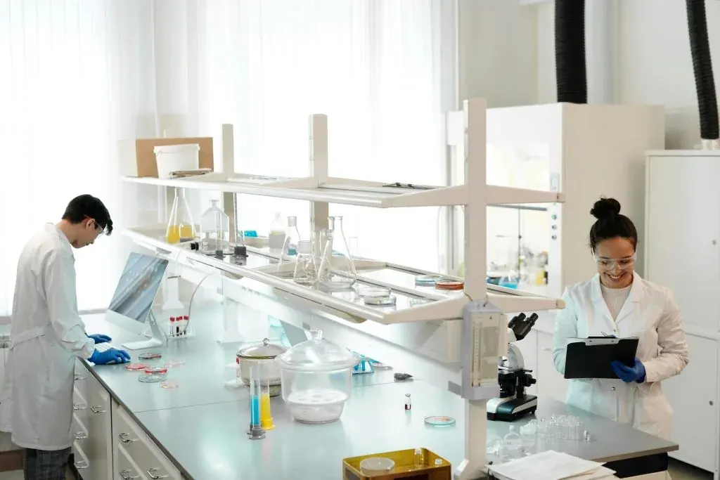 Biotechnology students carrying out practical project work in a laboratory